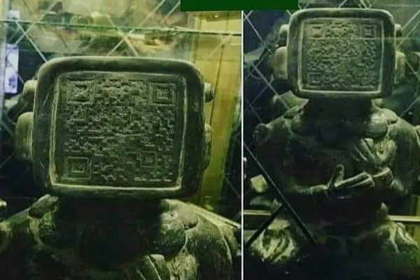 There is a QR code on the front of an ancient Mayan statue.